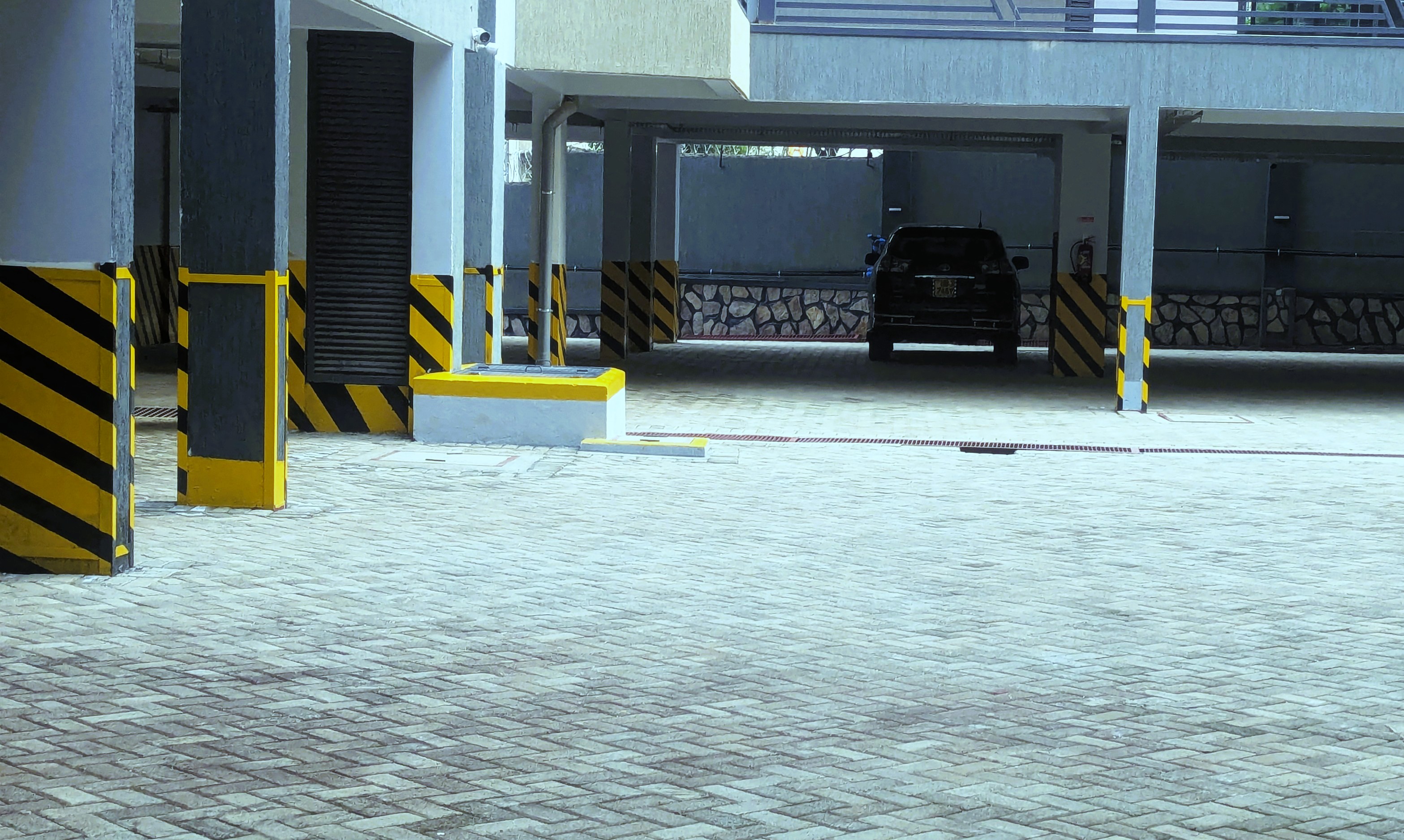 Spacious secure parking lot at MEK Apartments with 24/7 monitoring